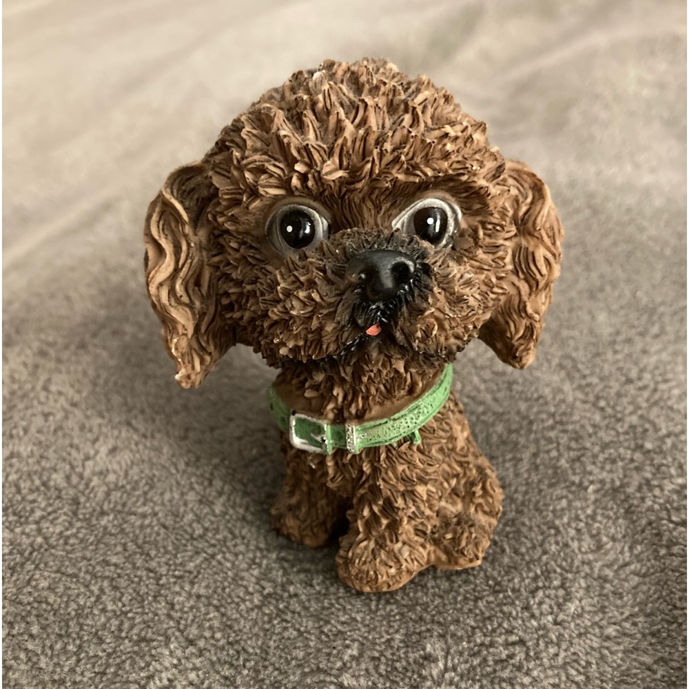 Small brown poodle dog statue